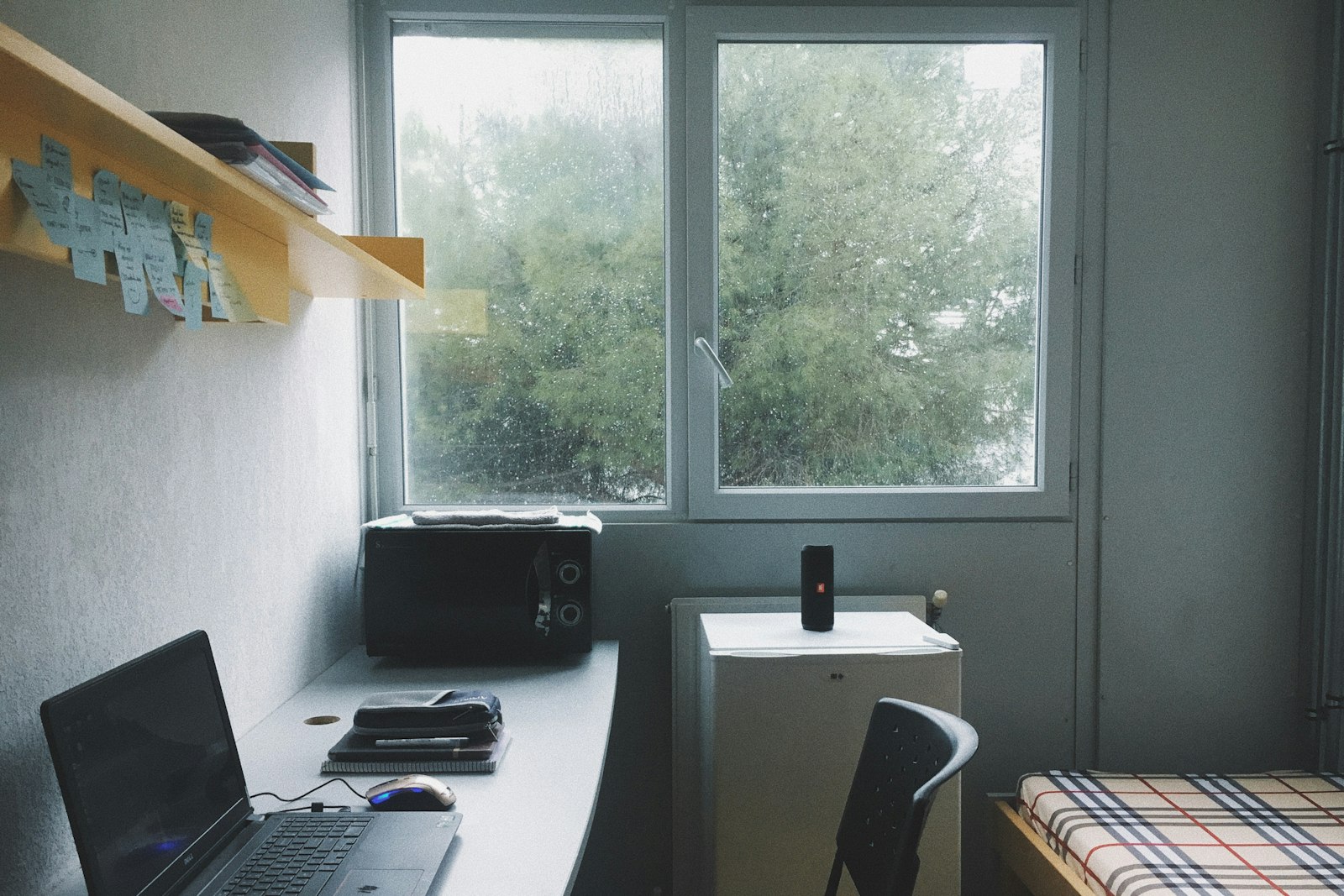 Hall room desk with a laptop by the window