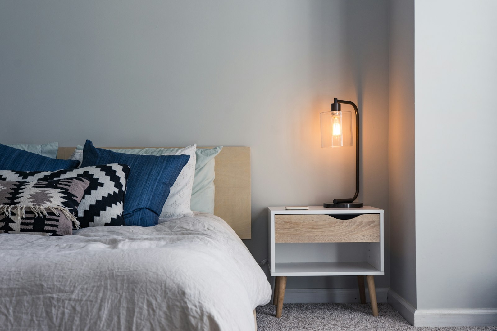 Bedroom with a double bed and a bedside lamp